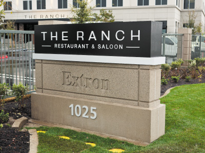 The outside view of THE RANCH Restaurant & Saloon street signs.