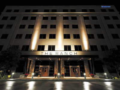 The outside, nighttime view of the main entrance to THE RANCH Restaurant & Saloon.