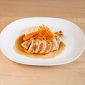 Our Jidori Airline Chicken is a refined comfort classic, finished with truffle butter and a rich white wine chicken jus.