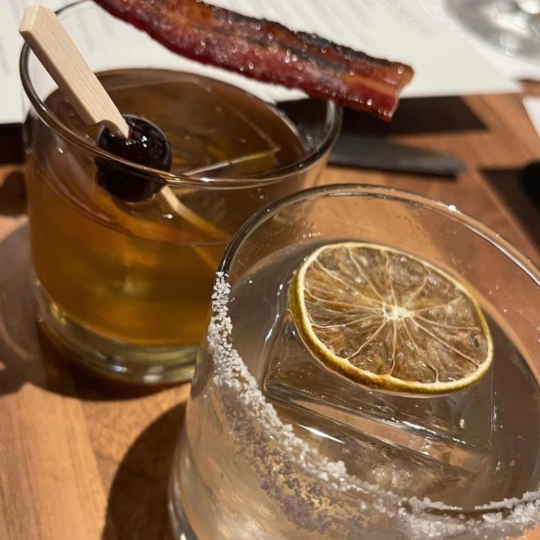 Bacon-Infused Elijah Craig Straight Rye, Amontillado Sherry, House Made Demerara Syrup, Orange Bitters, Candied Bacon