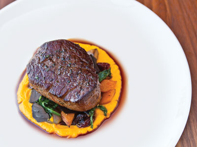 30-ounce steak prepared New York Delmonico-style served over a bed of steamed vegetables in a rich sauce.