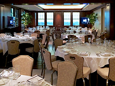 The Hospitality Suite dining area, with set tables.